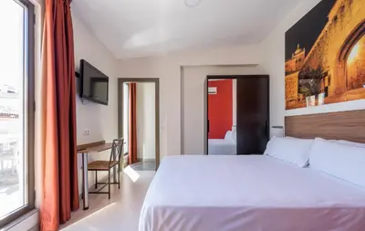 Cama o camas de una habitación en Baluart Apartments