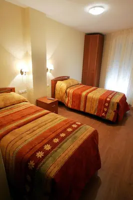 Cama o camas de una habitación en Hostal Hispanico II