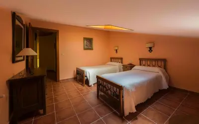Cama o camas de una habitación en Vivienda de Uso Turístico La Atalaya
