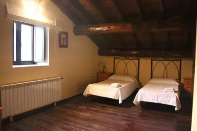 Cama o camas de una habitación en Casa Rural la Cancha I