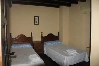 Cama o camas de una habitación en Casa Rural la Cancha I