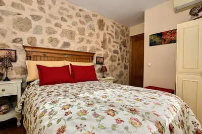Cama o camas de una habitación en Las Glicinias del Jerte