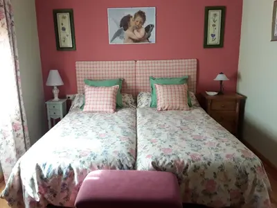 Cama o camas de una habitación en Las Glicinias del Jerte