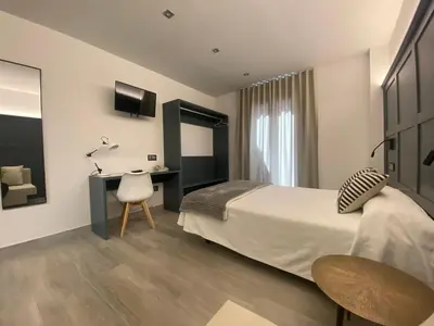 Cama o camas de una habitación en Hotel Lusitania, Centro Ciudad, Parking Privado