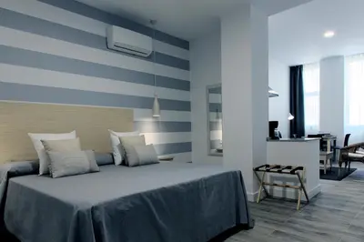 Cama o camas de una habitación en Hotel Apartamentos MPD