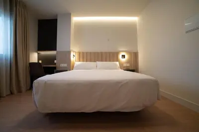 Cama o camas de una habitación en Yoanna Hotel