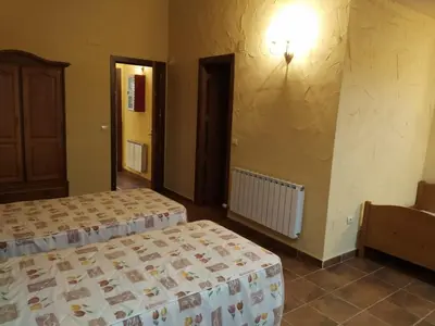 Cama o camas de una habitación en Viv. De Uso Turístico Fuente el Tejo - Casa Ana