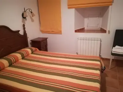Cama o camas de una habitación en Casa Rural Valdecorneja