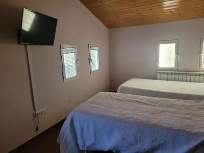 Cama o camas de una habitación en Casa Rural Los Riscos de Gredos