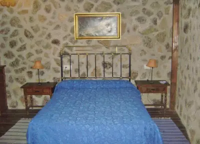 Cama o camas de una habitación en Casa Rural Menta y Canela