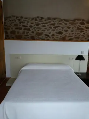 Cama o camas de una habitación en Casa Rural La Antigua Fragua