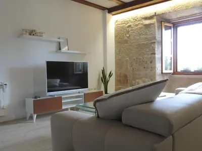 Una televisión o centro de entretenimiento en Apartamento Ribera Del Puente