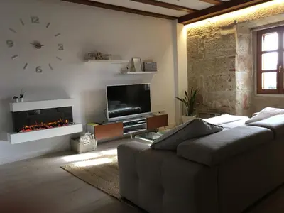 Una televisión o centro de entretenimiento en Apartamento Ribera Del Puente