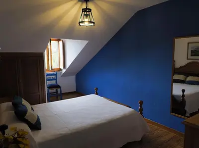 Cama o camas de una habitación en Hospedium Hostal Almanzor