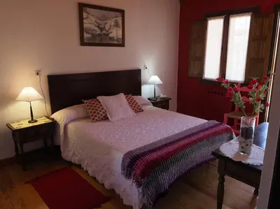 Cama o camas de una habitación en Hospedium Hostal Almanzor