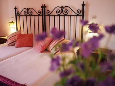 Cama o camas de una habitación en Hospedium Hostal Almanzor