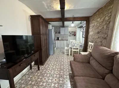 Una televisión o centro de entretenimiento en Apartamento CasaTrujillo