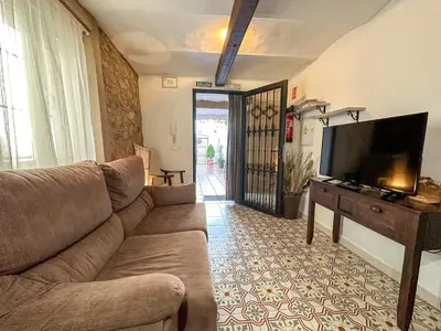 Una televisión o centro de entretenimiento en Apartamento CasaTrujillo