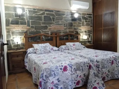 Cama o camas de una habitación en Apartamentos Rurales Tierras de Granadilla