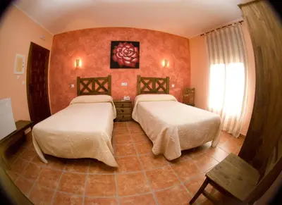 Cama o camas de una habitación en Hotel Rural El Arriero