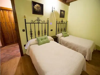 Cama o camas de una habitación en Casa Rural Apartamento Las Malpicas