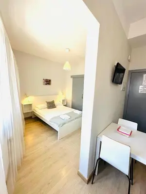 Cama o camas de una habitación en Apartamentos Templo Diana -Vistas Históricas-