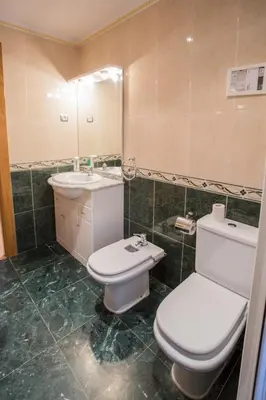 Un baño de APARTAMENTOS ABULA