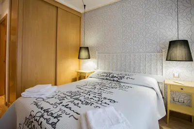 Cama o camas de una habitación en APARTAMENTOS ABULA