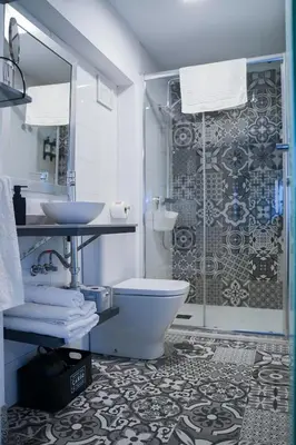 Un baño de Apartamentos Suites Cariátide