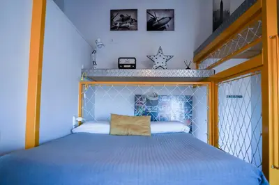 Cama o camas de una habitación en Apartamentos Suites Cariátide