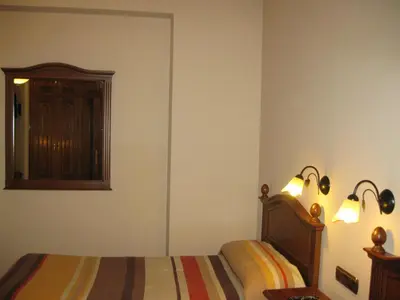 Cama o camas de una habitación en Hostal Granada