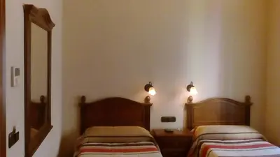 Cama o camas de una habitación en Hostal Granada