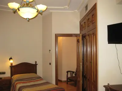 Cama o camas de una habitación en Hostal Granada