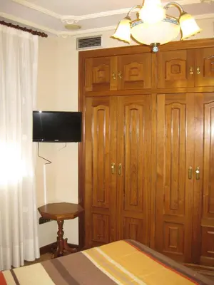 Una televisión o centro de entretenimiento en Hostal Granada