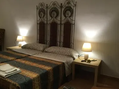Cama o camas de una habitación en Apartamentos Andrada