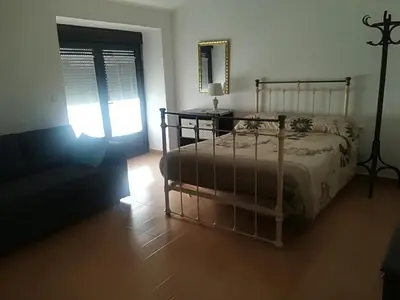 Cama o camas de una habitación en Apartamentos Andrada