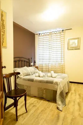 Cama o camas de una habitación en La Escapada ( Casa Rural de Gredos )