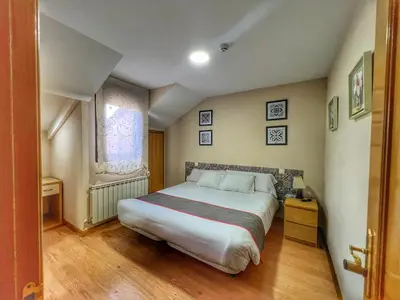 Cama o camas de una habitación en Hostal la Colmena