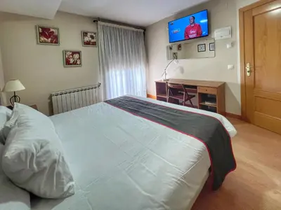 Cama o camas de una habitación en Hostal la Colmena
