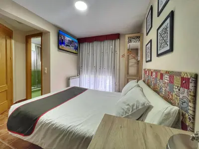 Cama o camas de una habitación en Hostal la Colmena
