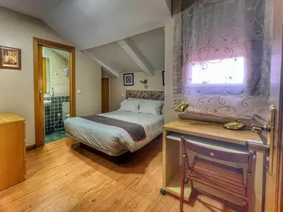 Cama o camas de una habitación en Hostal la Colmena