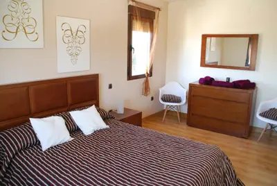 Cama o camas de una habitación en Casa Rural Mirando a Gredos