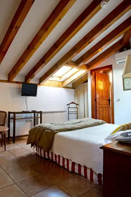 Cama o camas de una habitación en Hotel Rural La Casa De Pasarón