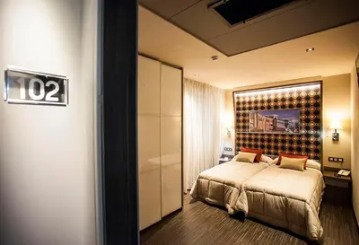 Cama o camas de una habitación en Hostal Barcelona