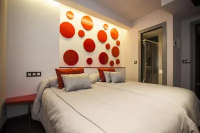 Cama o camas de una habitación en Hostal Barcelona