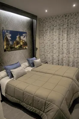 Cama o camas de una habitación en Hostal Barcelona