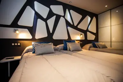 Cama o camas de una habitación en Hostal Barcelona