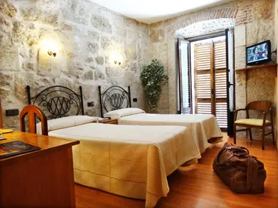 Cama o camas de una habitación en Palacio Antigua Audiencia