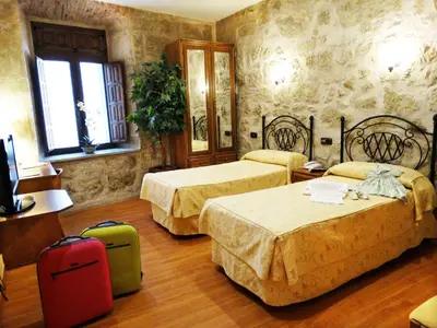 Cama o camas de una habitación en Palacio Antigua Audiencia