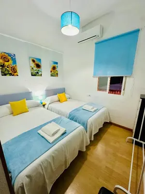 Cama o camas de una habitación en Apartamentos Jamé Mérida